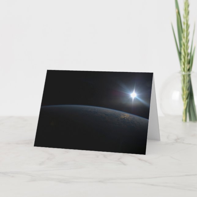 Tarjeta El Sol se pone sobre el horizonte de la Tierra. (Anverso)