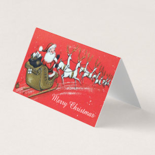 Tarjeta El viejo Papá Noel en su holgazán con renos