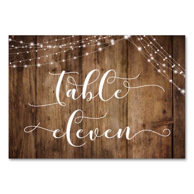 Tarjeta Eleven de mesa de madera y luces marrones  (Anverso)