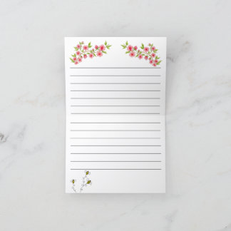 Tarjeta en blanco con flores rosadas