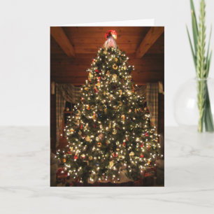 Tarjeta encendida del árbol de navidad