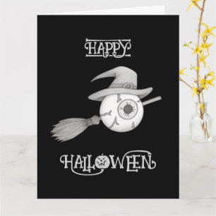 Tarjeta escoba de brujas de Halloween y el ojo temible