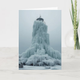 Tarjeta faro costero en invierno