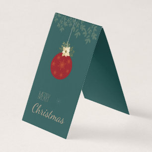 Tarjeta Feliz Navidad, bombilla roja con poinsettia blanca