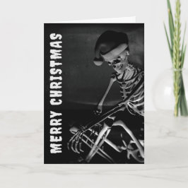 Tarjeta Feliz Navidad. Esqueleto con sombrero de Santa
