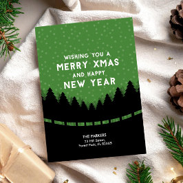 Tarjeta Feliz Navidad verde con árboles y nieve
