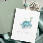 Tarjeta Festiva Acuarela de tortuga marina de Navidades costeros<br><div class="desc">Celebremos a los Navidades 2024 con esta adorable tarjeta de vacaciones temática de la playa, con mi original ilustracion acuarela pintado a mano de una tortuga marina adornada con bayas azules y rojas en vivos colores tropicales en un crujiente fondo blanco. La festiva "Feliz Navidad" está escrita en una tipografía...</div>