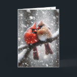 Tarjeta Festiva Cardenales navidades en una sucursal nevada<br><div class="desc">Un cardenal macho y una hembra se sientan de cerca en una rama cubierta de nieve rodeada de una serena nevada. Se puede cambiar el texto interno.</div>