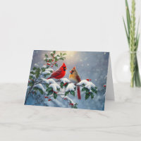 Cardenales rojos y Holly en la nieve