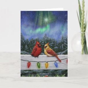 Tarjeta Festiva Cardenales y Navidades iluminan la nieve de invier