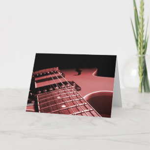 Tarjeta Festiva Cierre de la guitarra eléctrica encima del rojo de