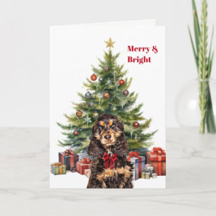 Tarjeta Festiva Cocker Spaniel negro y canela con lazo rojo en el 