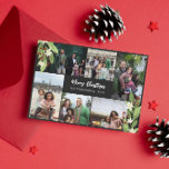 Tarjeta Festiva Collage de fotos de verde de Berry Rojo Feliz Navi<br><div class="desc">Foto de Navidades de collage con ramas verdes con flores blancas y bayas rojas enmarcando seis fotos de tu familia.</div>