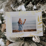 Tarjeta Festiva Con Relieve Metalizado Pressed Botanical | Horizontal Photo Gold<br><div class="desc">Elegant and understated holiday photo card frames a single horizontal or landscape-oriented photo with a white border,  on a background of gold foil botanical leaves and foliage. Personalize with your custom holiday greeting (shown with "Merry Christmas"),  your family name,  and the year.</div>