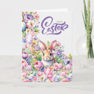 Tarjeta Festiva Conejo alegre de Pascua en flores de primavera