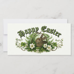 Tarjeta Festiva Conejo de Pascua en follaje floral