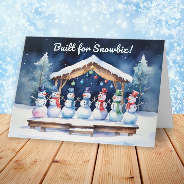 Tarjeta Festiva Construido para los divertidos Navidades Snowbiz (A funny Christmas card with picture of snowmen on a wooden stage, with humorous caption)