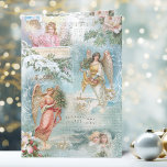 Tarjeta Festiva Coro del Viejo Collage de los Ángeles de Invierno<br><div class="desc">Encantador collage de hermosos ángeles victorianos,  pinos cubiertos de nieve,  rosas,  holly,  música de Navidades,  tipografía,  evergreens y paisajes rurales rústicos rodeados de delicados filigres blancos sobre fondo azul cielo claro.</div>