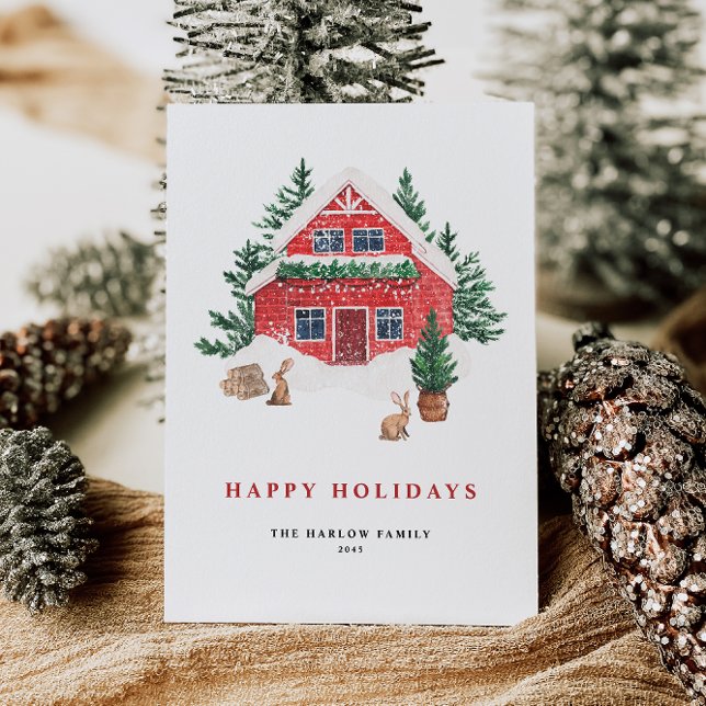 Tarjeta Festiva Cozy Watercolor Red Cottage Evergreen Forest (This holiday card features a beautifully illustrated red cottage nestled in a snowy evergreen forest)
