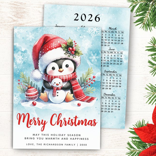 Tarjeta Festiva Cuidados pingüinos, azul y moro rojo (Merry Christmas Card with a Cute Penguin in a Santa Hat, 2026 Calendar on a Backside of the Card)