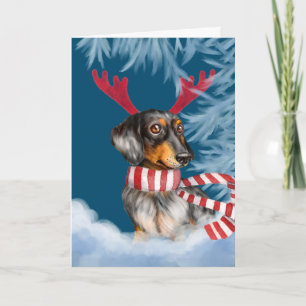 Tarjeta Festiva Dachshund a través de la nieve