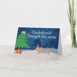Tarjeta Festiva Dachshund a través de la nieve