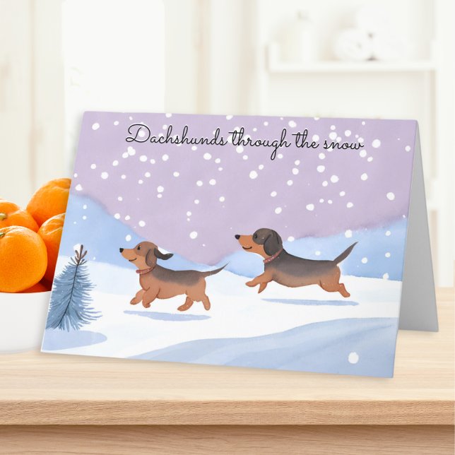 Tarjeta Festiva Dachshunds A Través De Los Navidades De Perros De  (A Christmas card with picture of two cute sausage dogs and caption 'Dachshunds through the snow')