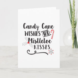 Tarjeta Festiva deseos de bastón de caramelo y besos bajo el muérd