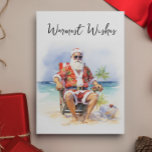 Tarjeta Festiva Deseos más cálidos de Santa en la playa<br><div class="desc">Este diseño fue creado a través del arte digital y puede ser personalizado en el área que proporciona cambiando la foto y/o el texto. O puede personalizarse eligiendo la opción de hacer clic en el personalizar y borrar o cambiar el color del fondo, agregar texto, cambiar el color o estilo...</div>