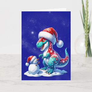 Tarjeta Festiva Dinosaurio con sombrero de santa construyendo un m