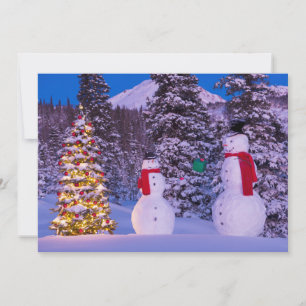 Tarjeta Festiva Dos hombres de nieve intercambian regalos por el 