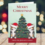 Tarjeta Festiva Dos Navidades Personalizados tricolor Corgi Dogs C<br><div class="desc">Estos hermosos perros tricolor Pembroke Welsh Corgi tienen la cabeza inclinada dentro de un lindo gorra de Santa Claus. Las dos crías están sentadas frente a un árbol de Navidad bonito decorado con adornos coloridos. Bonita tarjeta de vacaciones de corgis con un maravilloso dibujo de un dúo de corgi rojo...</div>