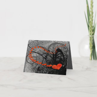 Tarjeta Festiva El corazón negro y rojo se balancea