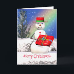 Tarjeta Festiva El regalo navideño de Snowman<br><div class="desc">Una tarjeta de saludo de Navidades con mi imagen original de un muñeco de nieve sonriente sosteniendo un regalo de Navidades el día del Navidad.</div>