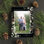 Tarjeta Festiva Elegant Winter Watercolor Greenery Botanical Photo<br><div class="desc">This elegant holiday photo card features a single vertical photo framed by beautiful watercolor eucalyptus, holly, and berries over a chic black background. The editable greeting on the front says "Happy Holidays". The back of the card is a coordinating foliage pattern, which can be removed if desired. You can also...</div>