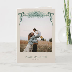 Tarjeta Festiva Elegante lazo con vegetación Navideña Foto doblada