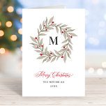 Tarjeta Festiva Elegantes Navidades Verdor Monograma Wreath<br><div class="desc">Esta elegante tarjeta de Navidades plegados presenta una sencilla cortina de agua de invierno con bayas rojas y un apellido de familia personalizado monograma inicial. El elegante texto rojo, verde gris y gris oscuro incluye el texto de bienvenida "Feliz Navidad" junto con el apellido de tu familia y el año....</div>