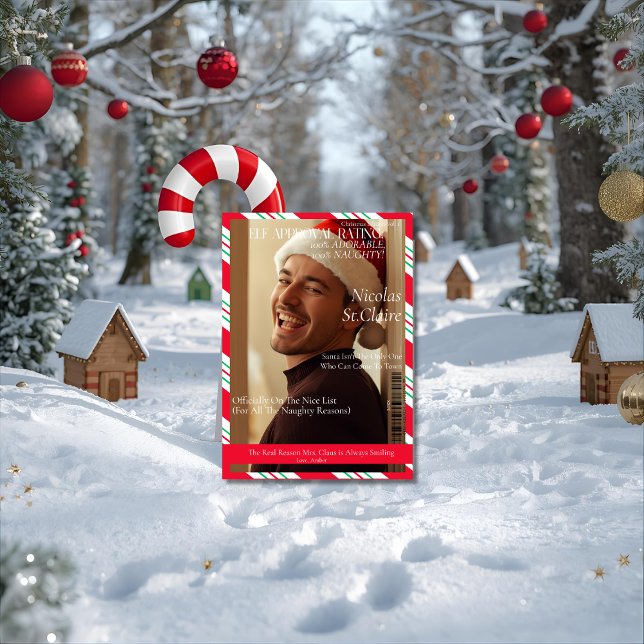 Tarjeta Festiva Elf Approval Rating boyfriend husband magazine   (Front-view outdoor mockup of a 5x7 'Elf Approval Rating' card leaning against a giant candy cane in )