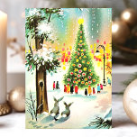Tarjeta Festiva Escena de árbol navideño de conejitos de nieve vin<br><div class="desc">Vintage Snow Bunnies Christmas Tree Scene Holiday Card. Este diseño presenta conejos en la nieve frente a un árbol de Navidad iluminado. Qué hermosa escena de vacaciones retro. Personalice este diseño personalizado con su propio saludo interno.</div>