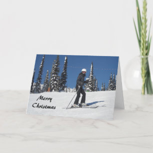 Tarjeta Festiva Escena de nieve con esquiadora