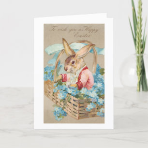 Tarjeta Festiva Fancy Easter Bunny en la cesta con nomeolvides