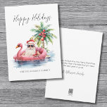 Tarjeta Festiva Felices Fiestas Navidades de Santa Claus Beach<br><div class="desc">Sumérjase en el espíritu de las vacaciones con esta tarjeta de Navidades única que incluye un Santa Claus relajado con gafas de sol en un flamenco rosa flotando en el océano. Perfecto para enviar deseos de vacaciones en la playa, esta tarjeta es ideal para cualquiera que viva en lugares tropicales...</div>