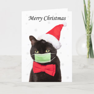 Tarjeta Festiva Feliz felino navideño en Santa Hat y Mask