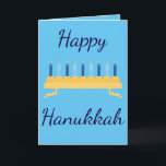 Tarjeta Festiva Feliz Hanukkah Blue Menorah<br><div class="desc">Celebra el gran festival de las luces con esta tarjeta de felicitación temática Happy Hanukkah. "Happy Hanukah" está escrito con hermosas letras cursivas de azul oscuro con velas azules. El interior de la tarjeta tiene un mensaje encantador. ¡Elige la tuya! Cortesía de Sonya DeHart Design en: http://www.sonyadehartdesign.com |http://www.sonyadehartdesign.etsy.com</div>