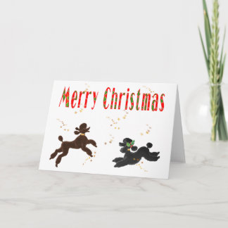 Tarjeta Festiva Feliz Navidad, chocolate y caniche negro jugando
