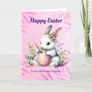 Tarjeta Festiva Feliz Pascua, conejo blanco pintando un huevo de P