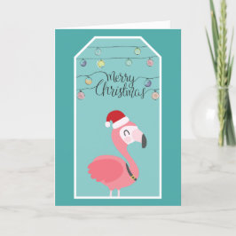 Tarjeta Festiva Flamingo bebé con sombrero de santa y luces de nav