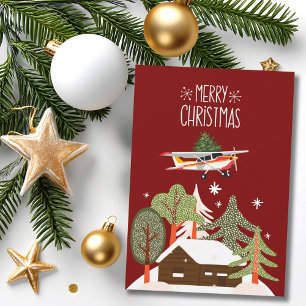 Tarjeta Festiva Foto divertida de un avión Cessna que lleva árbol