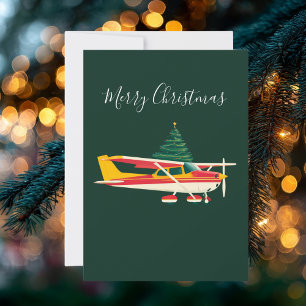 Tarjeta Festiva Foto divertida de un avión Cessna que lleva árbol 