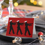 Tarjeta Festiva Funny Zombie Santa Navidades Red<br><div class="desc">Zombis con sombreros de Santa Roja caminando en fila con brazos muertos o estirados frente a ellos. Una graciosa tarjeta de vacaciones para un fanático del horror este Navidad.</div>